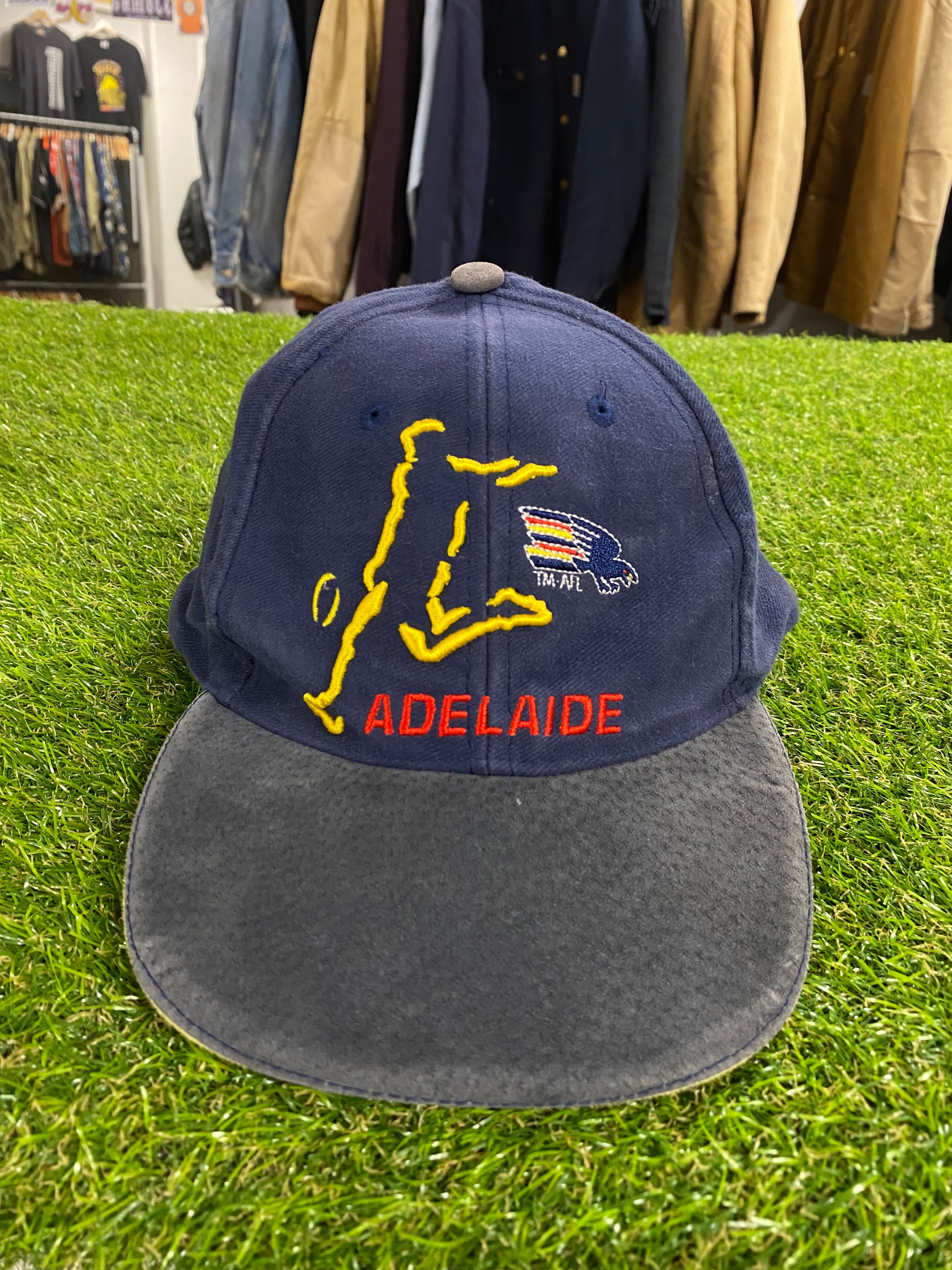 Vintage Adelaide Crows Cap Player Kicking Ball Outline