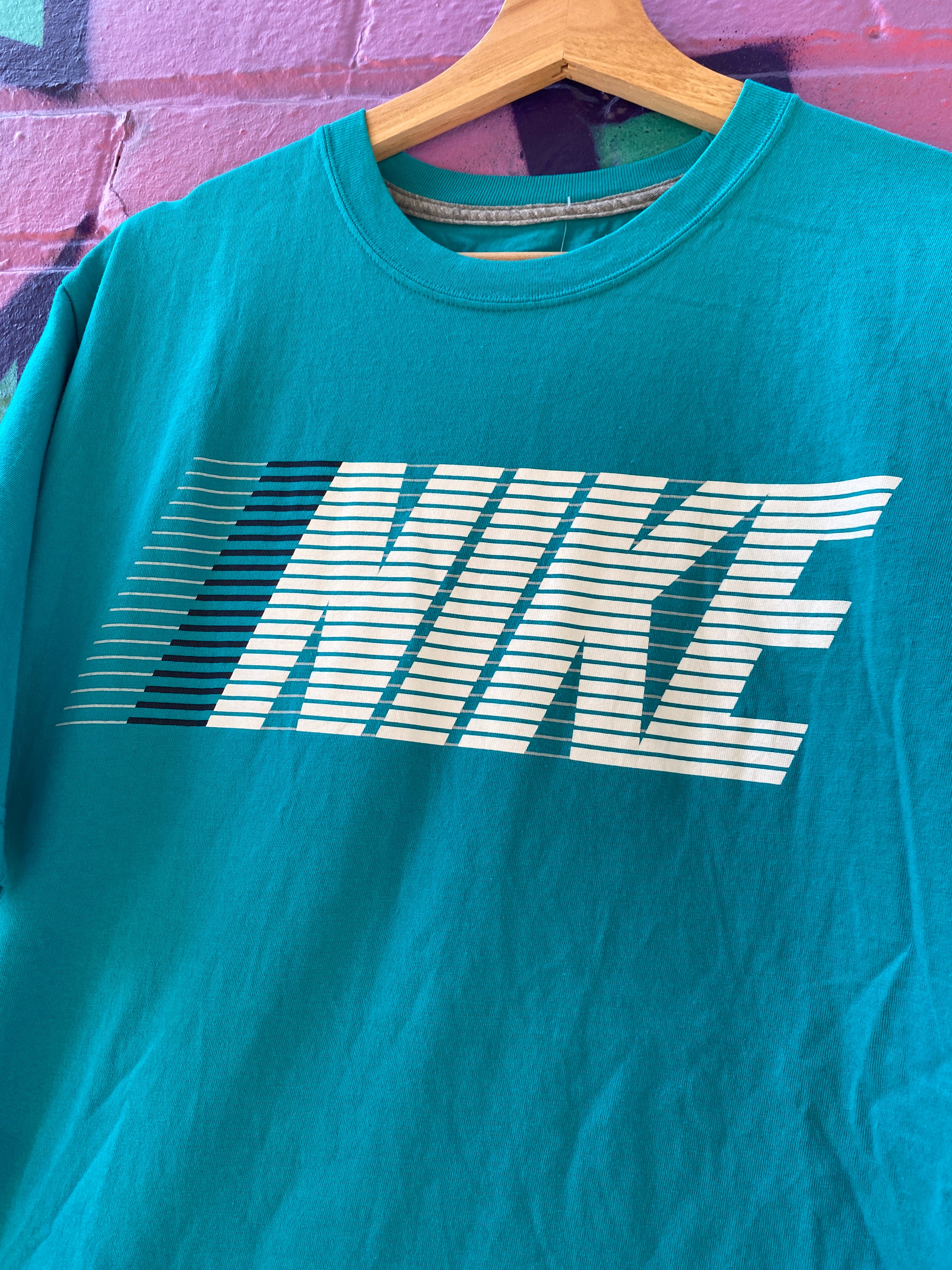 L - Turquoise Nike Lined Spellout Tee